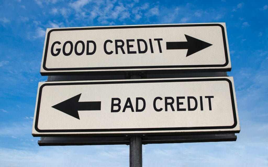 Signs pointing to good and bad credit directions.