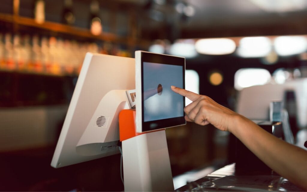 Person using touchscreen at restaurant counter
