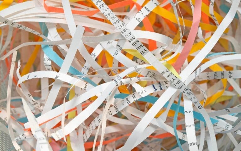 Colorful shredded paper scraps close-up.