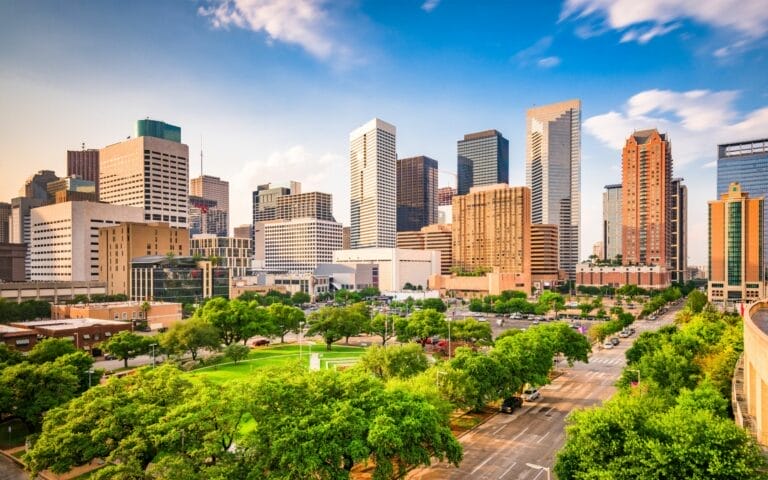 Houston downtown skyline with trees and buildings.