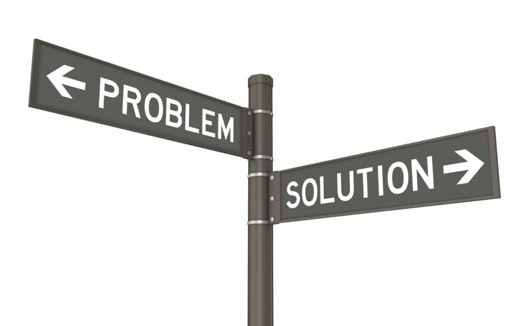 Signpost showing problem and solution directions.