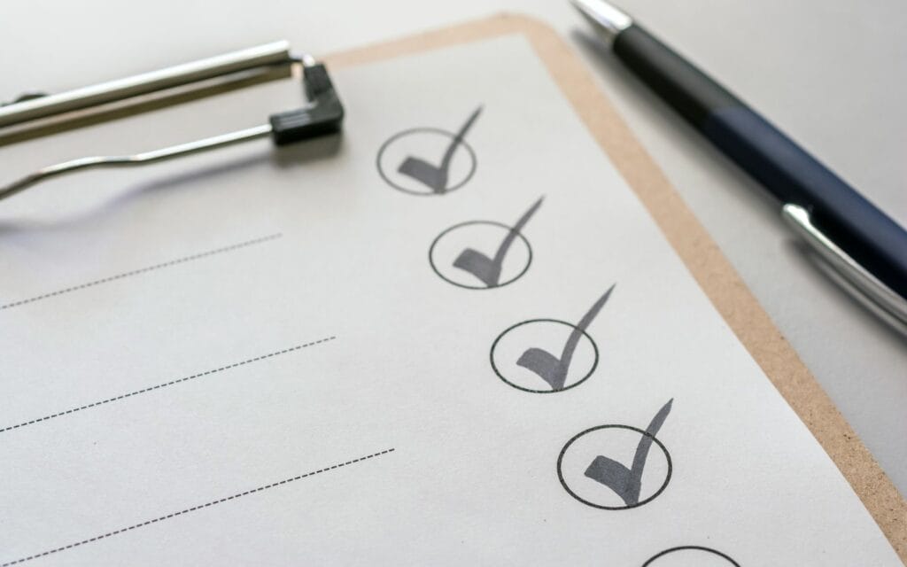 Checklist with pen on clipboard