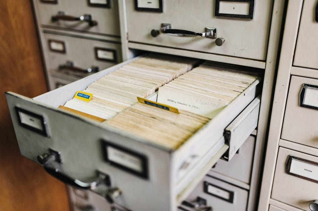 Open file cabinet drawer with index cards