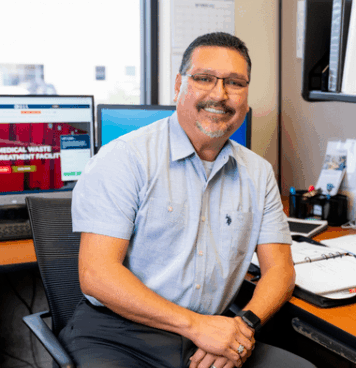 Photo of Robert Greenfield sitting in office chair