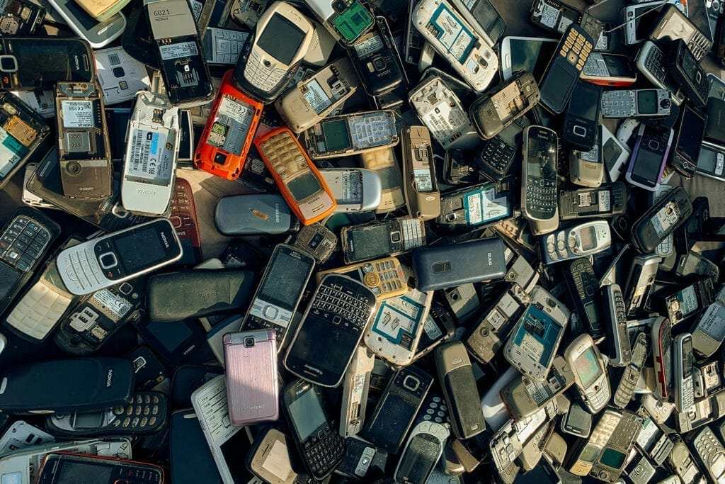 Pile of old mobile phones for recycling