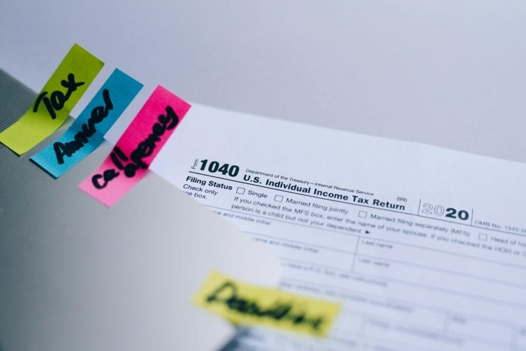 Tax form 1040 with sticky notes, U.S. 2020.