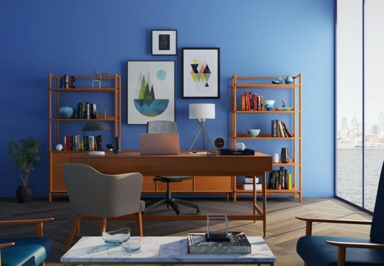 Modern office with blue walls and wooden furniture.