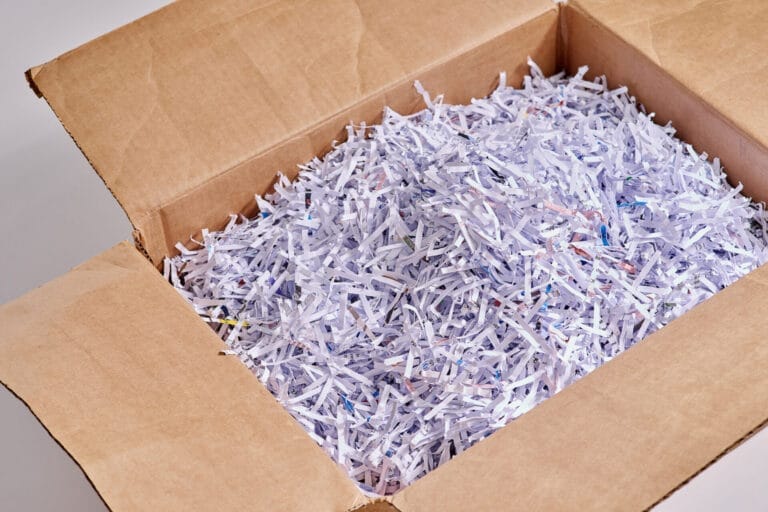 Box of shredded paper for recycling.
