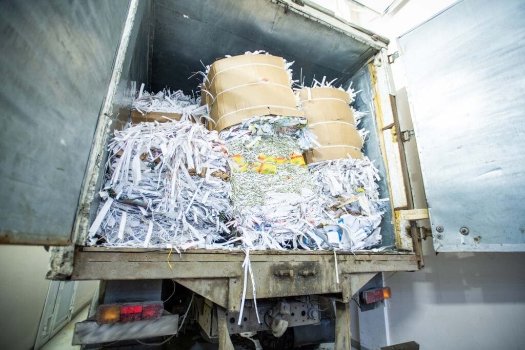 Truck loaded with shredded paper waste.